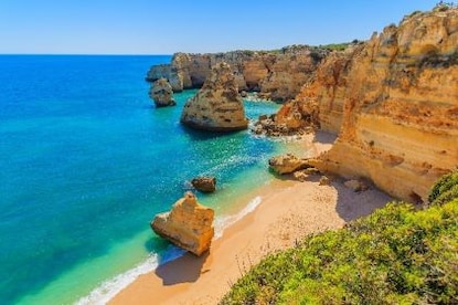 Stunning coastal cliffs, turquoise waters, blue skies, Spain. 