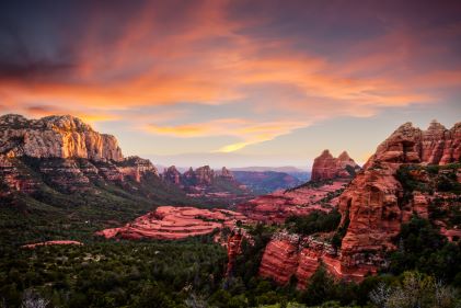 Breathtaking aerial image, dramatic red rocks and canyons, sunset painted skies, Sedona, Arizona.