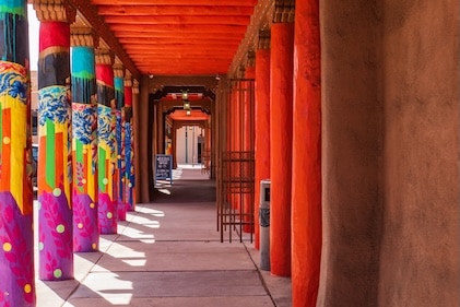 Colorfully painted columns line the plaza in downtown Santa Fe, New Mexico.