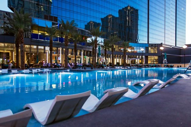 Pool and chairs at the Elara, a Hilton Grand Vacations Club
