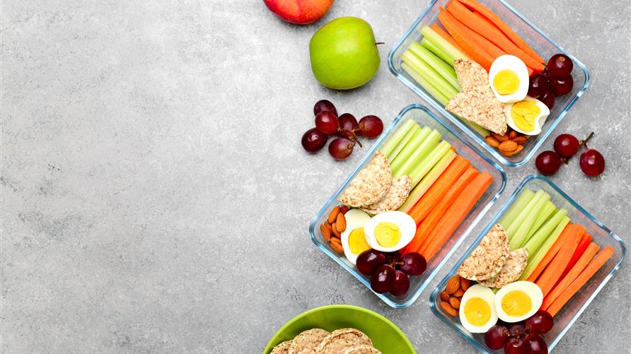 Meal prep containers with healthy food choices.