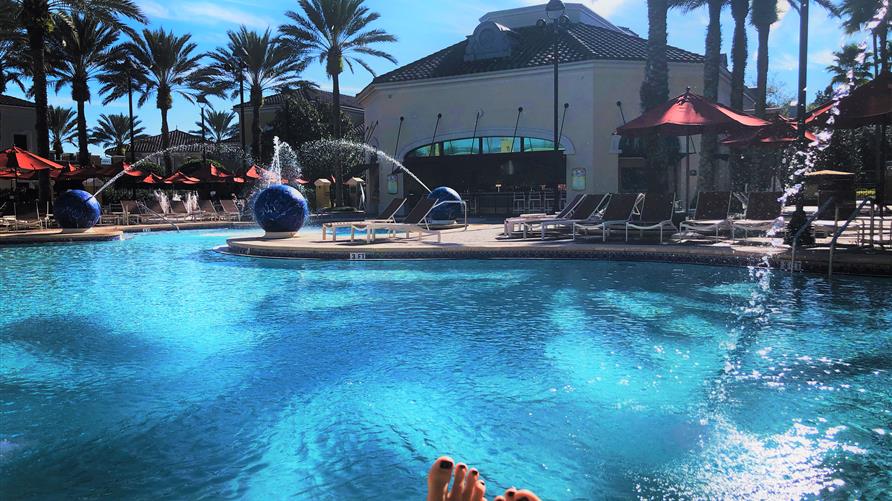A shot of a Hilton Grand Vacations pool  from the perspective of a Hilton Grand Vacations timeshare Owner. 