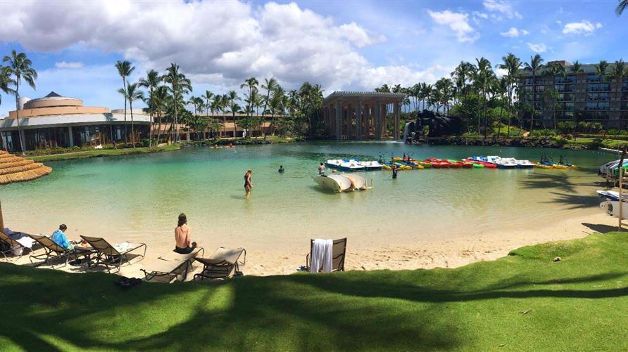 People swimming in the lagoon at Hilton Waikoloa Village on the Big Island. 