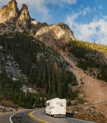 RV traveling down a mountain road
