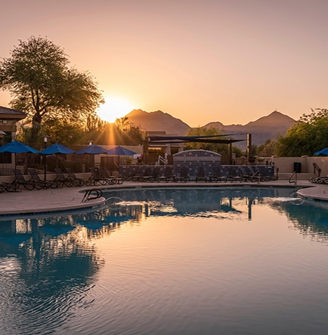 Pool at sunset at Scottsdale Links Resort, a Hilton Vacation Club located in Arizona.