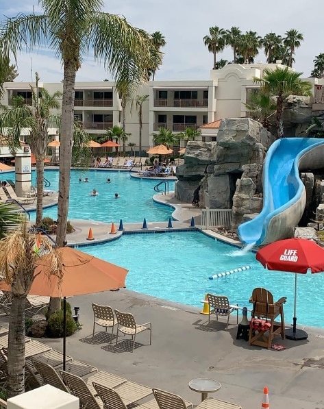 A view of the courtyard pool and slide from a guest room.