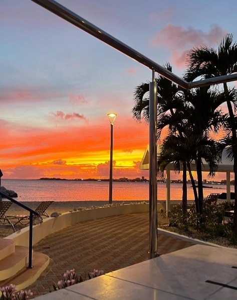 A view of the colorful sunset over the Caribbean from Flamingo Beach, a Hilton Vacation Club.