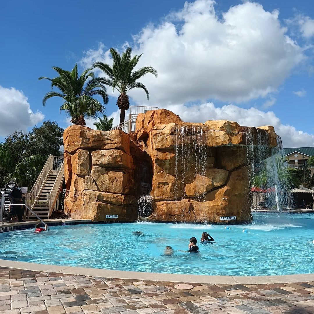 Pool with rock formation at Mystic Dunes, a Hilton Vacation Club located in Orlando, Florida.