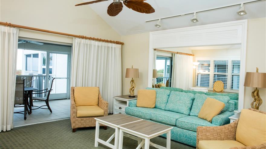 Living room and patio at Casa Ybel Resort located at Sanibel Island, Florida.