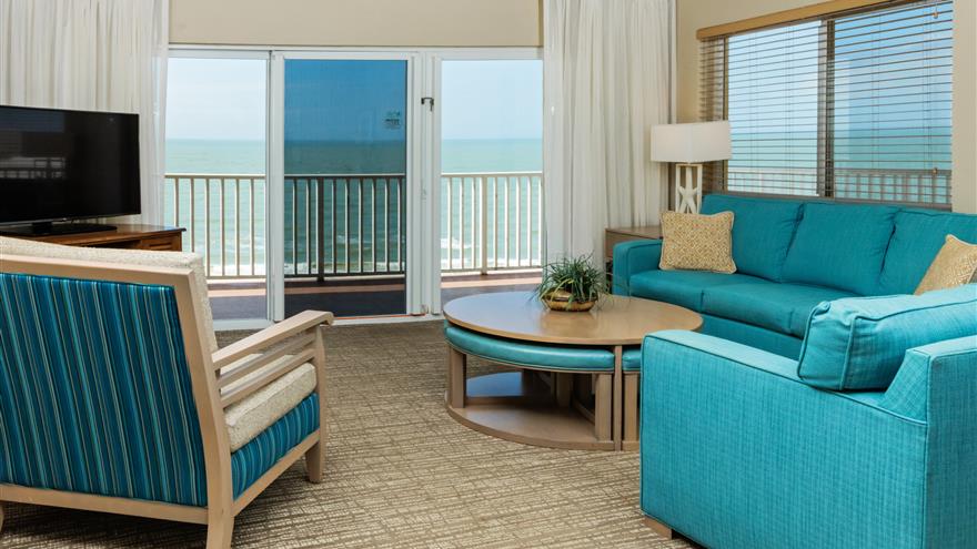 Living room with an oceanview at The Charter Club of Marco Beach located in Florida.