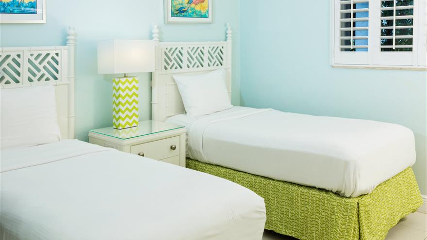 Bedroom with two beds at Plantation Beach Club at Indian River Plantation