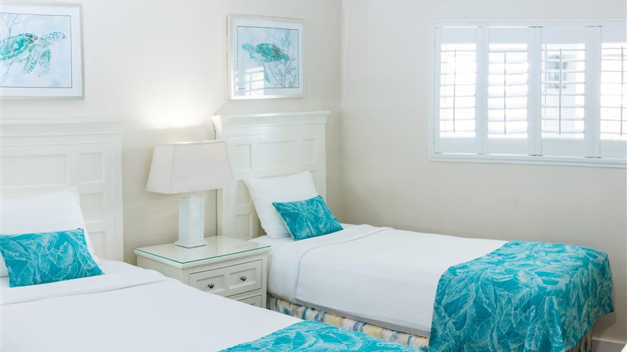 Two beds in a bedroom at Overhead view of Shell Island Beach Club Resort located on Sanibel Island, Florida