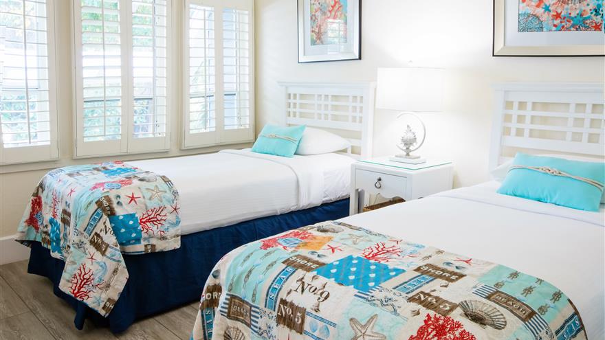 Bedroom with two beds at The Cottages at South Seas Island Resort located at Captiva Island, Florida
