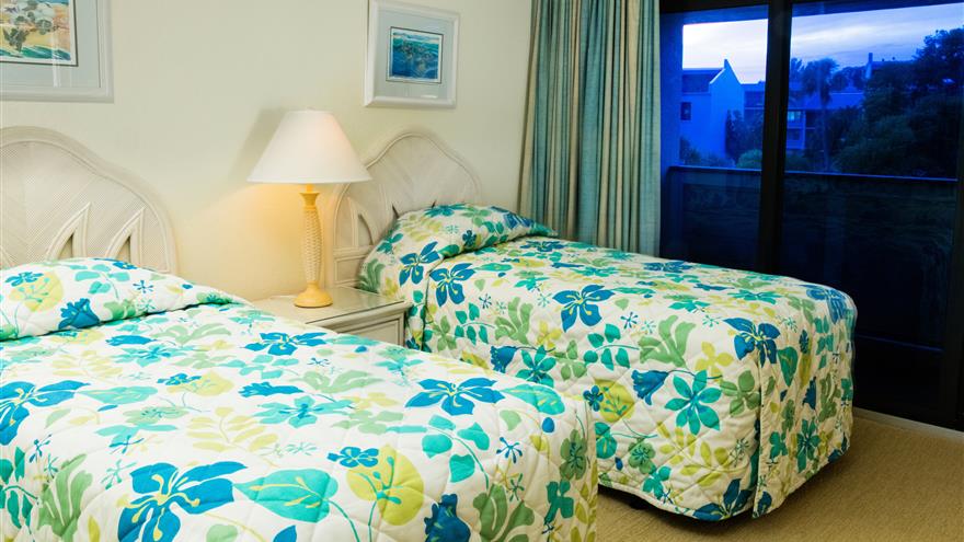 Bedroom with two beds at Tortuga Beach Club Resort located at Sanibel Island, Florida.