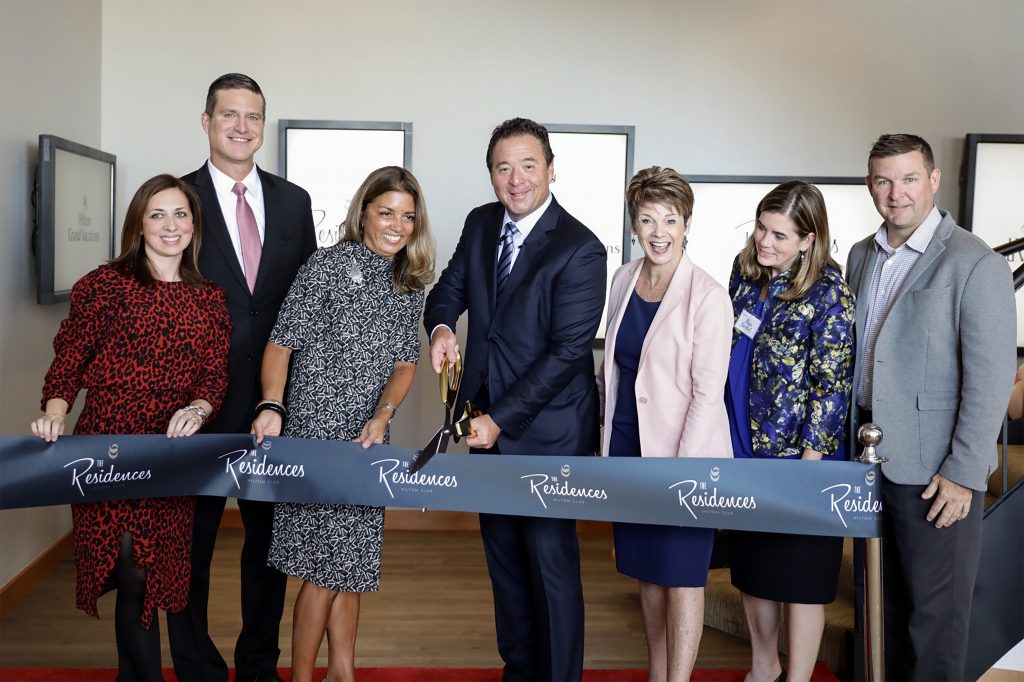 CEO Mark Wang cuts the ribbon at the grand opening ceremony for The Residences by Hilton Club