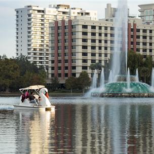 A swan shaped paddle boat near the fountain in Lake Eola in downtown Orlando, Florida. 