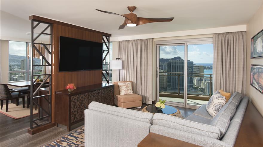 Living room in a suite at The Grand Islander, a Hilton Grand Vacations Club at Waikiki Beach in Oahu, Hawaii
