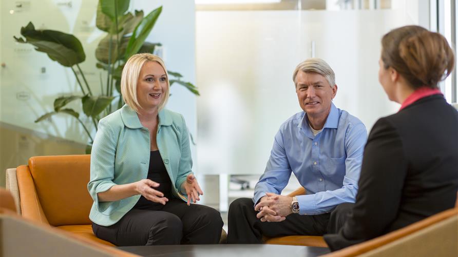 Older couple meeting with Hilton Grand Vacations