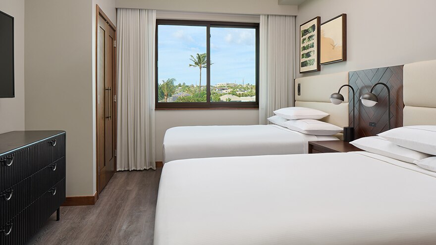 Bedroom with two beds in a suite at Maui Bay Villas, a Hilton Grand Vacations Club at Maui, Hawaii. 