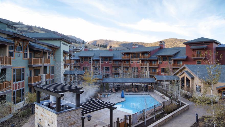 Balcony view of courtyard and pool at Sunrise Lodge, a Hilton Grand Vacations Club located in Park City, Utah. 